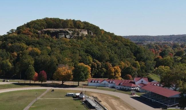 a large wooded area and a horse racing stadium